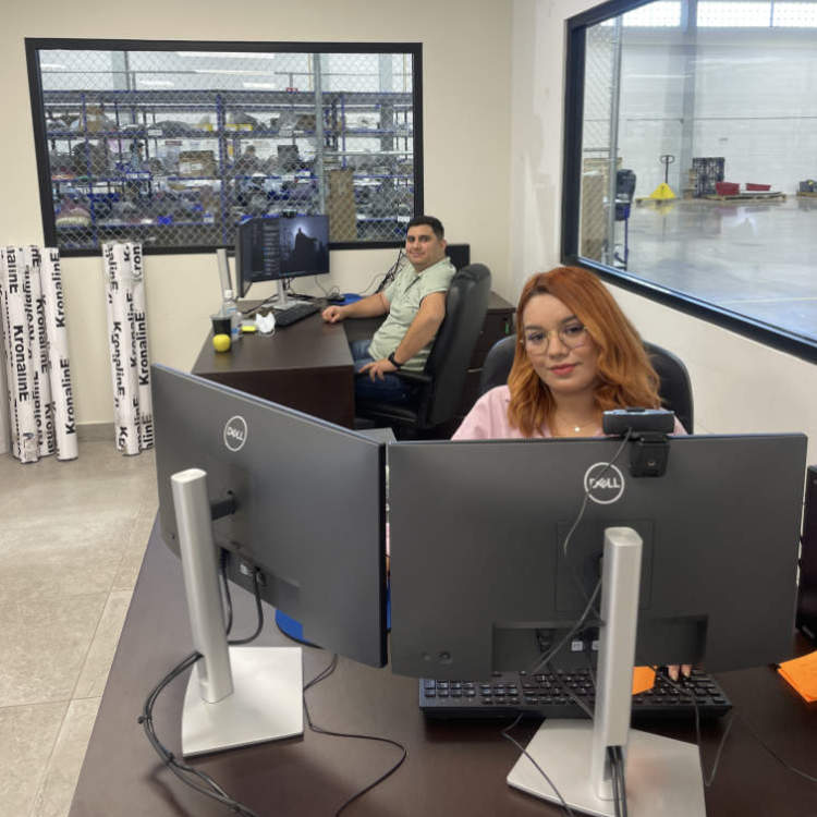 workers at their desk behind computer screens